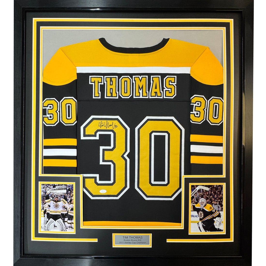 Framed Tim Thomas Signed Boston Bruins Jersey with JSA Authentication: Framed Tim Thomas Signed Boston Bruins Jersey with JSA Authentication This professionally framed and matted Boston Bruins hockey jersey features the autograph of Tim Thomas, a celebrated NHL player. M