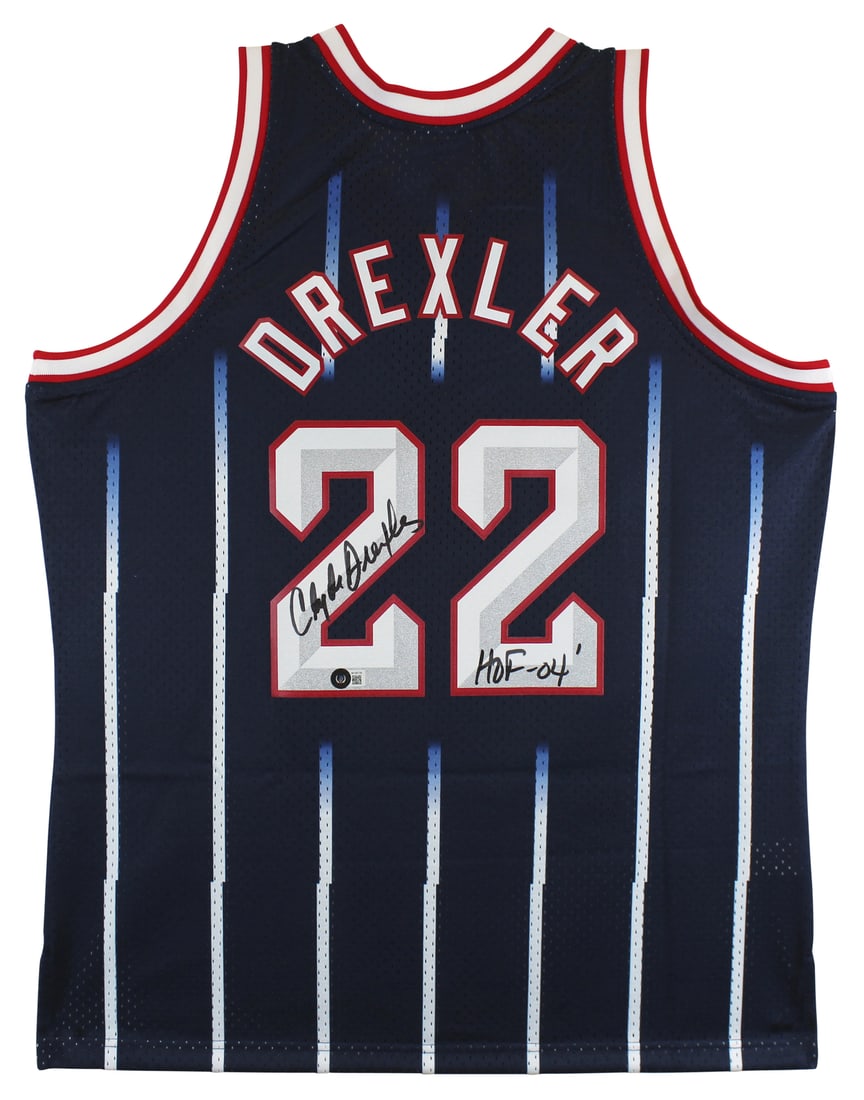 Clyde Drexler Signed Navy Jersey HOF 04 Mitchell & Ness BAS Witnessed: Clyde Drexler Signed Navy Jersey HOF 04 Mitchell & Ness BAS Witnessed This authentic navy blue Mitchell & Ness jersey features the iconic Clyde Drexler's autograph, complete with the inscription "HOF