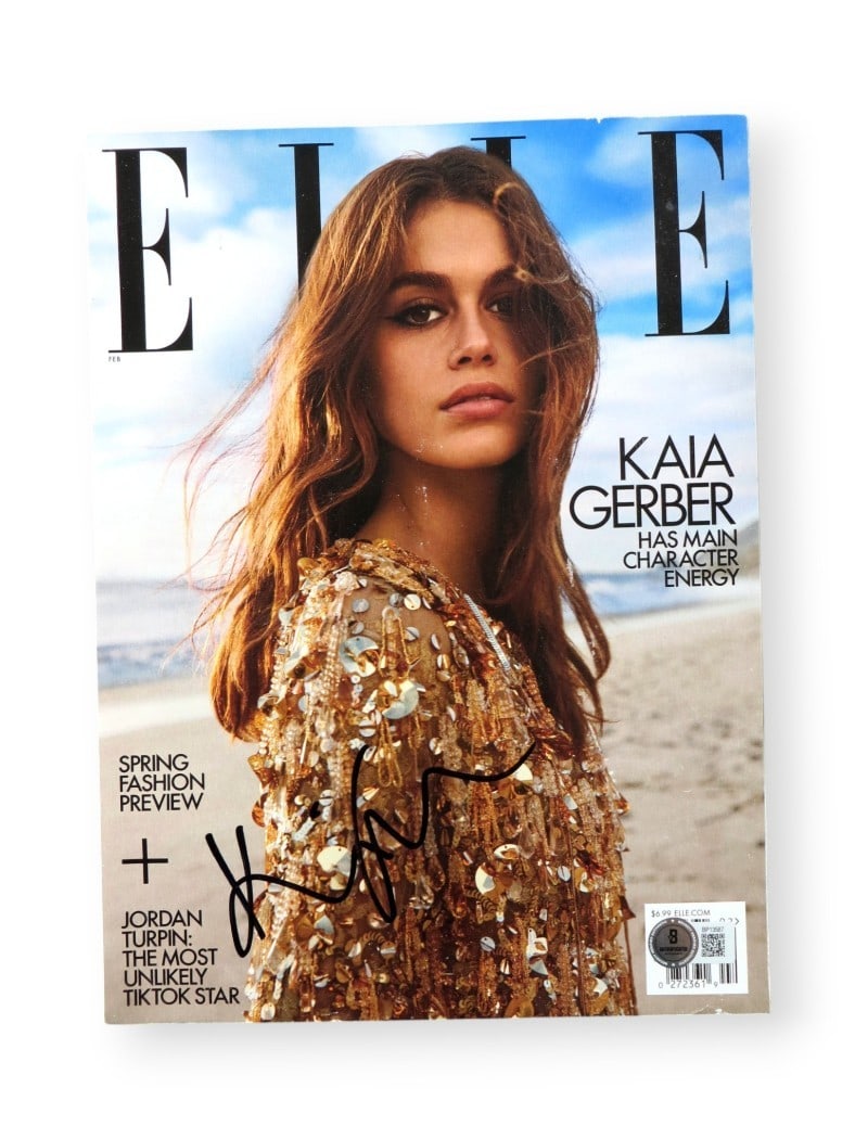 Kaia Gerber Signed Elle Magazine Beach Photoshoot Beckett Authenticated: Kaia Gerber Signed Elle Magazine Beach Photoshoot Beckett Authenticated This is an original magazine featuring Kaia Gerber, autographed by the model herself. The magazine showcases a stunning beach-th