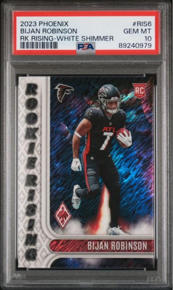 2023 Panini Phoenix Bijan Robinson #RIS6 Rookie Card PSA 10 White Shimmer: 2023 Panini Phoenix Bijan Robinson #RIS6 Rookie Card PSA 10 White Shimmer This 2023 Panini Phoenix Bijan Robinson #RIS6 White Shimmer Rookie Card is a remarkable collectible, graded at PSA 10 by the P