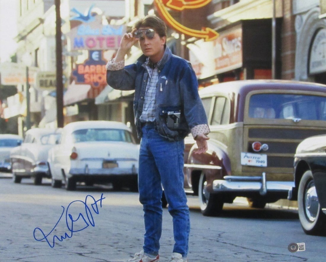 Michael J Fox Back to the Future Autographed 16x20 Photo Beckett Certified: Michael J Fox Back to the Future Autographed 16x20 Photo Beckett Certified This is an original autographed 16 x 20 inch photograph of Michael J. Fox from the iconic movie "Back to the Future." The sig