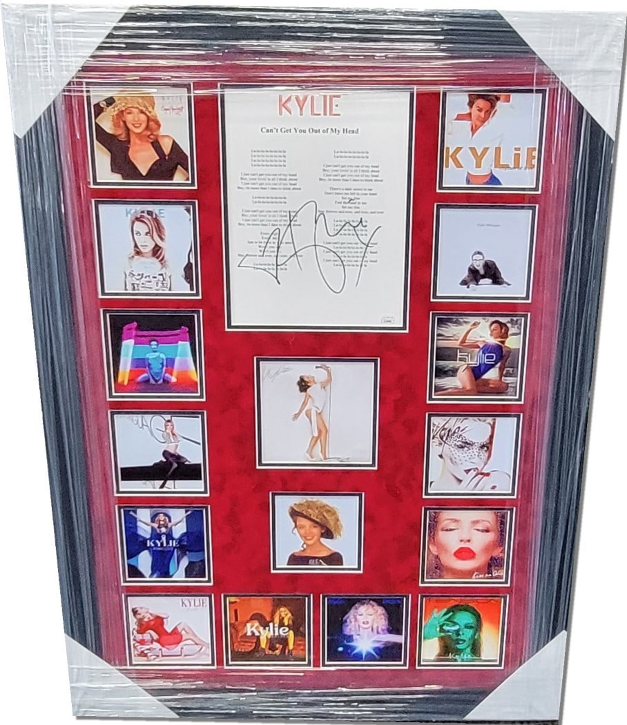 Kylie Minogue Signed Script Framed Collage 26x36 JSA Authenticated: Kylie Minogue Signed Script Framed Collage 26x36 JSA Authenticated This striking framed collage features a hand-signed script from Kylie Minogue's iconic song "Can't Get You Out Of My Mind." The piece