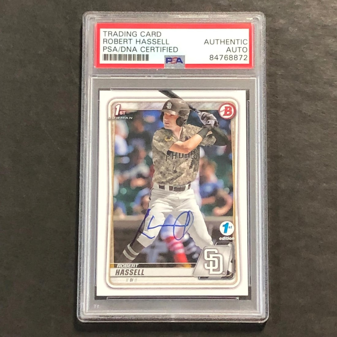 2021 1st Bowman Baseball Robert Hassell Signed Card PSA/DNA Slabbed: 2021 1st Bowman Baseball Robert Hassell Signed Card PSA/DNA Slabbed This listing features a 2021 1st Bowman Baseball #BD-39 card signed by Robert Hassell, a player known for his time with the San Dieg