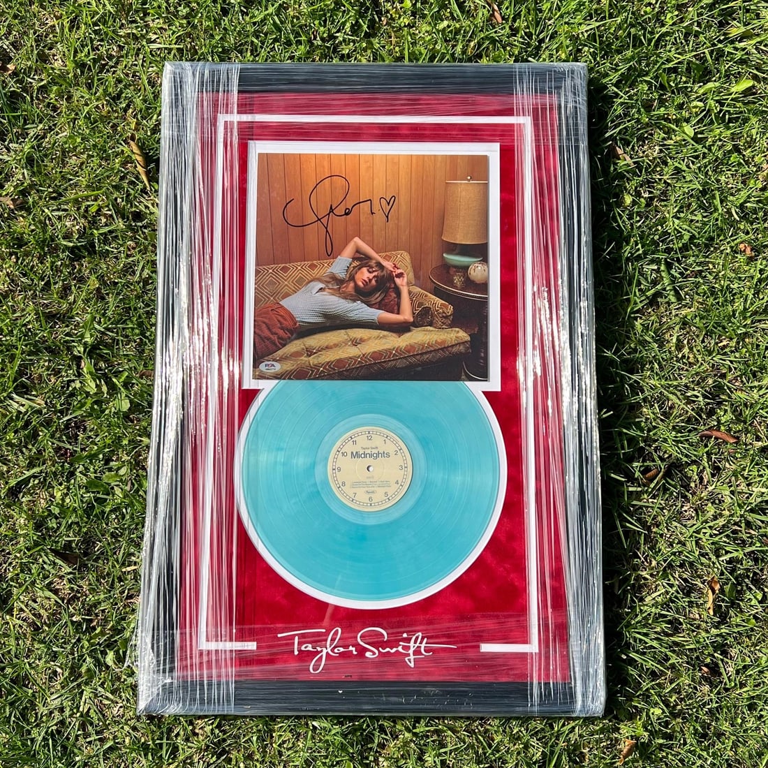 Taylor Swift Signed Midnights Vinyl Cover PSA/DNA 30x20 Framed: Taylor Swift Signed Midnights Vinyl Cover PSA/DNA 30x20 Framed This stunning framed vinyl cover features the autograph of Taylor Swift, authenticated by PSA/DNA, ensuring its authenticity. The cover s