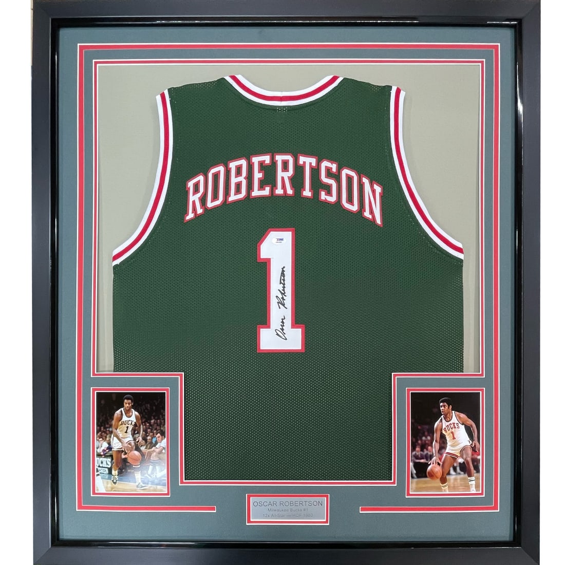 Framed Oscar Robertson Signed Milwaukee Bucks Jersey with PSA COA: Framed Oscar Robertson Signed Milwaukee Bucks Jersey with PSA COA This professionally framed and matted piece features a signed Milwaukee Bucks jersey by NBA legend Oscar Robertson. Measuring 33"x42",