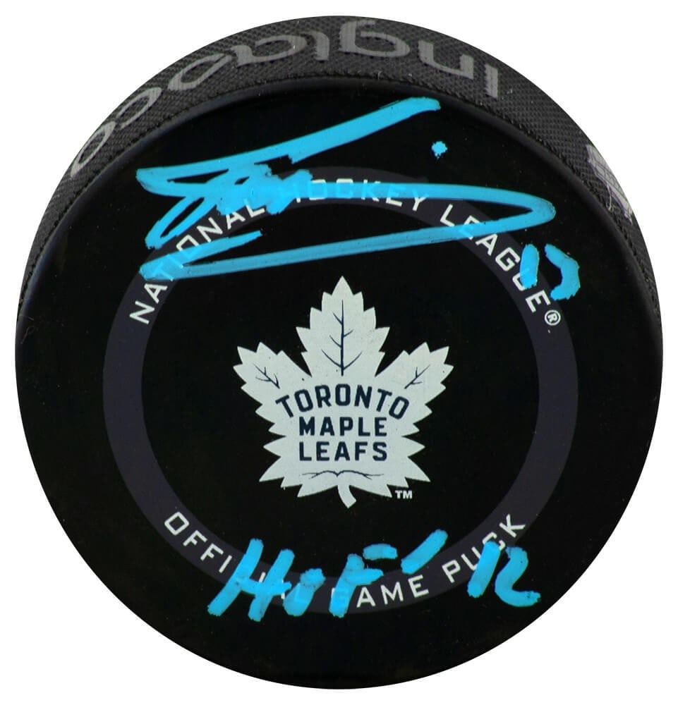 Toronto Maple Leafs Official Puck Signed by Mats Sundin with HOF 12 Inscription: Toronto Maple Leafs Official Puck Signed by Mats Sundin with HOF 12 Inscription This is an official game hockey puck featuring the Toronto Maple Leafs logo, hand-signed by Mats Sundin with a 'HOF 12'