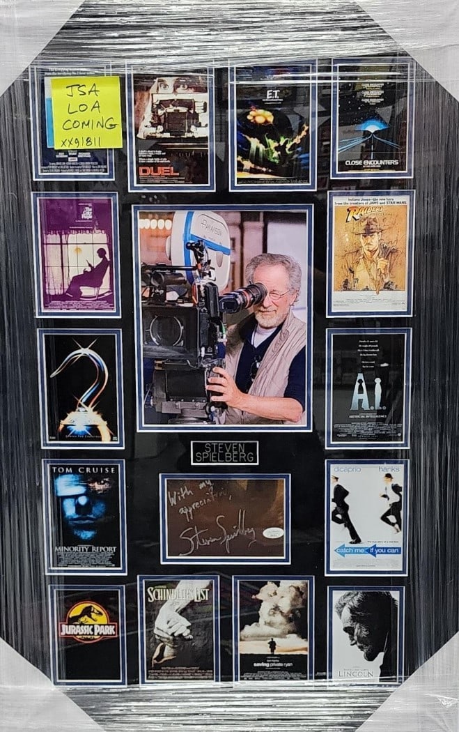 Steven Spielberg Signed Jurassic Park Collage Framed 22x34 JSA Authenticated: Steven Spielberg Signed Jurassic Park Collage Framed 22x34 JSA Authenticated This is an original framed collage photograph featuring the iconic director Steven Spielberg, showcasing his work on both J