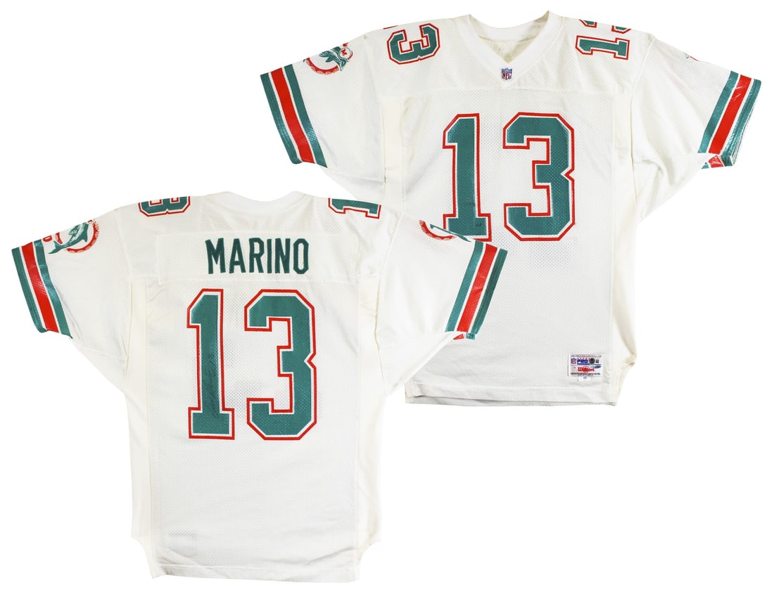 Dan Marino Autographed Miami Dolphins White Wilson Jersey Beckett Authenticated: Dan Marino Autographed Miami Dolphins White Wilson Jersey Beckett Authenticated This is an authentic Wilson Proline white jersey, size 48, personally signed by Dan Marino of the Miami Dolphins. The au