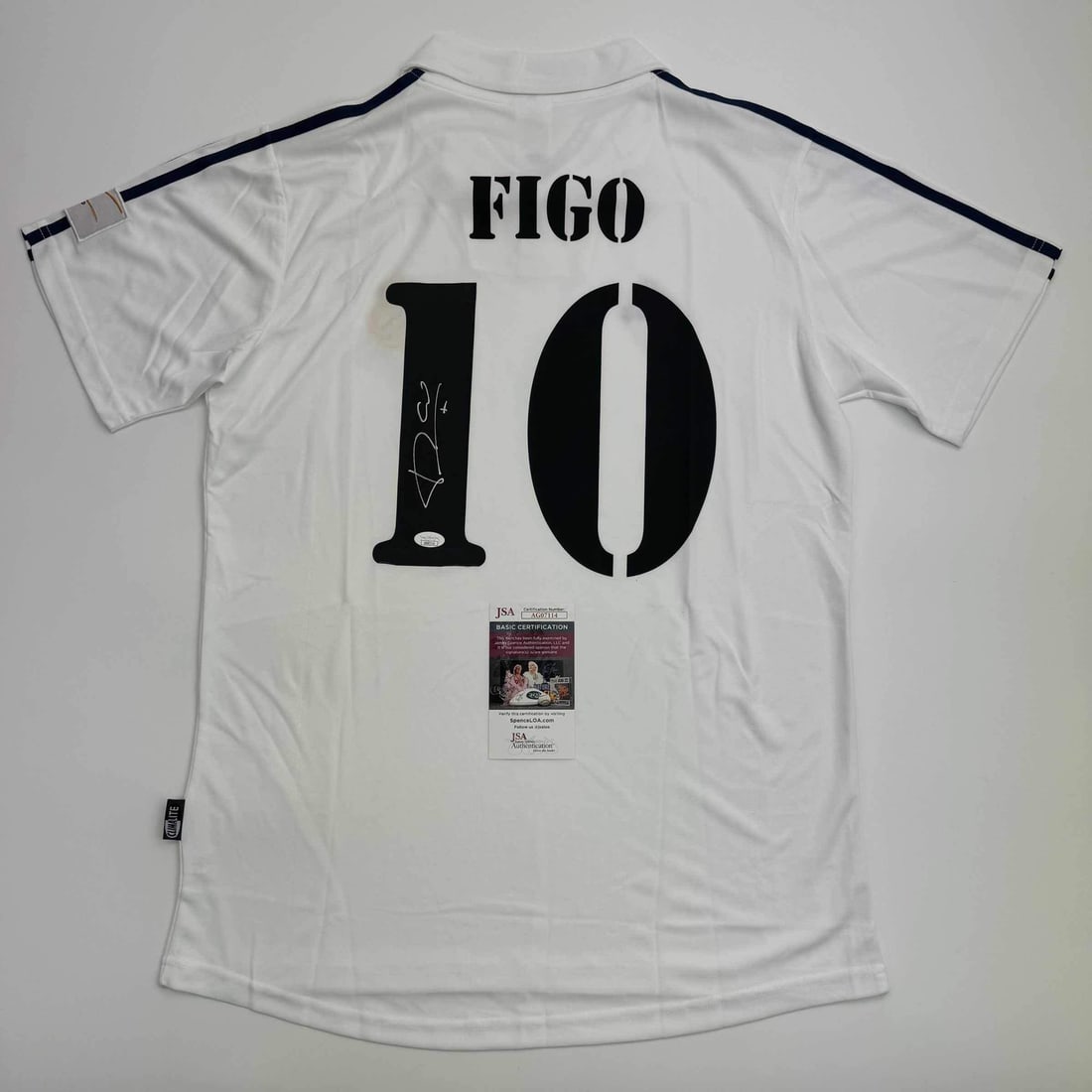 Autographed Luis Figo Real Madrid White Jersey Beckett COA: Autographed Luis Figo Real Madrid White Jersey Beckett COA Own a unique piece of soccer history with this autographed Luis Figo Real Madrid white soccer jersey. This original, custom jersey features t
