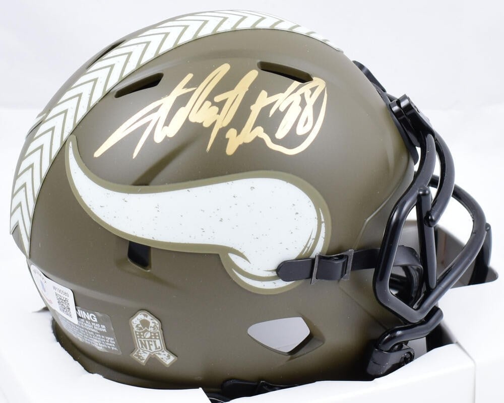 Adrian Peterson Signed Vikings Mini Helmet Beckett Authenticated: Adrian Peterson Signed Vikings Mini Helmet Beckett Authenticated This collectible mini helmet is a tribute to Adrian Peterson, featuring his signature and honoring the Salute to Service initiative. It