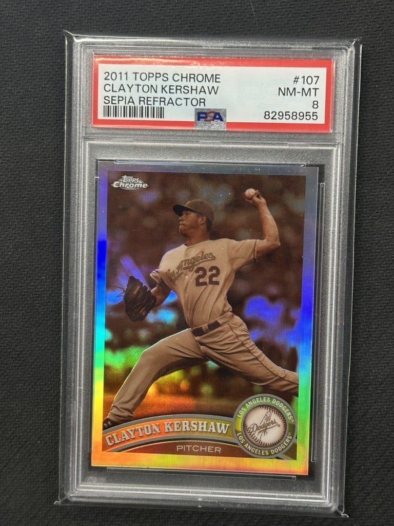 Clayton Kershaw 2011 Topps Chrome Sepia Refractor PSA 8 #107 Dodgers: Clayton Kershaw 2011 Topps Chrome Sepia Refractor PSA 8 #107 Dodgers This is a 2011 Topps Chrome Sepia Refractor baseball card featuring Clayton Kershaw, a prominent player for the Los Angeles Dodgers