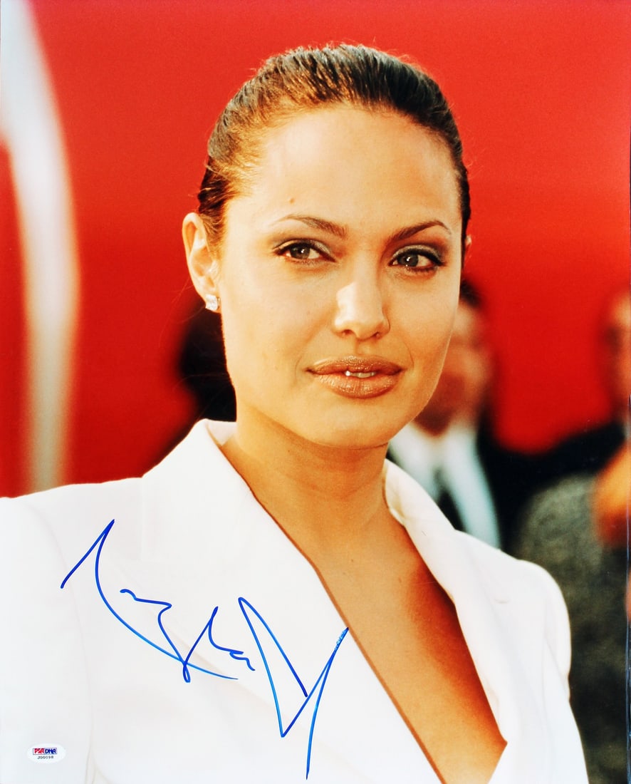 Angelina Jolie Signed 16x20 Photo Mr & Mrs Smith PSA/DNA Certified: Angelina Jolie Signed 16x20 Photo Mr & Mrs Smith PSA/DNA Certified This stunning 16x20 photograph features the talented Angelina Jolie, personally signed in bold ink. The image is from the iconic film