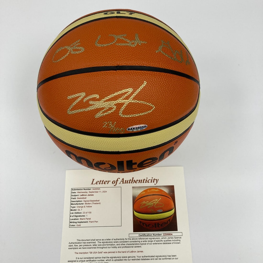LeBron James Signed 2008 USA Gold Basketball Limited Edition 23/100 UDA JSA: LeBron James Signed 2008 USA Gold Basketball Limited Edition 23/100 UDA JSA This is a limited edition basketball signed by LeBron James, a celebrated player in the sport. The ball features a striking