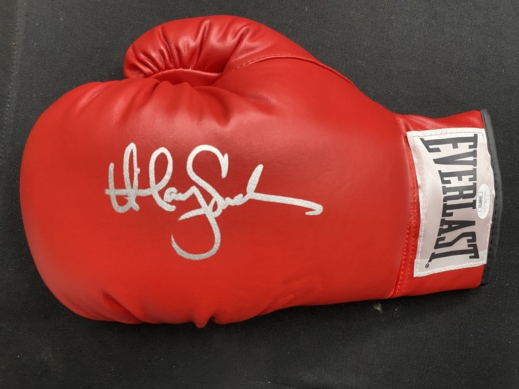 Hilary Swank Signed Boxing Glove JSA Authenticated Million Dollar Baby: Hilary Swank Signed Boxing Glove JSA Authenticated Million Dollar Baby This is an authentic boxing glove hand-signed by actress Hilary Swank, known for her role in the Oscar-winning film 'Million Doll
