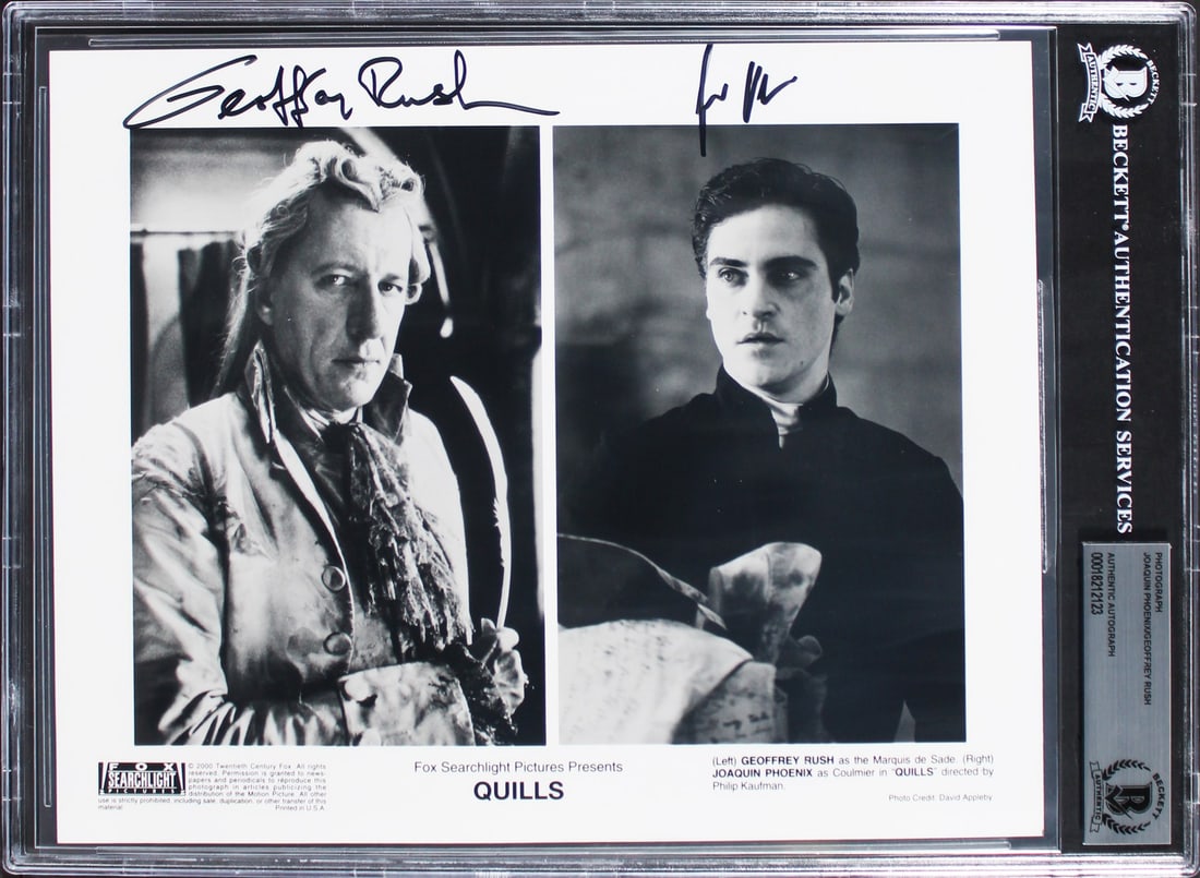 Joaquin Phoenix Geoffrey Rush Signed 8x10 Quills Photo BAS Authenticated: Joaquin Phoenix Geoffrey Rush Signed 8x10 Quills Photo BAS Authenticated This authentic 8x10 photograph features the signatures of acclaimed actors Joaquin Phoenix and Geoffrey Rush from the film Quil