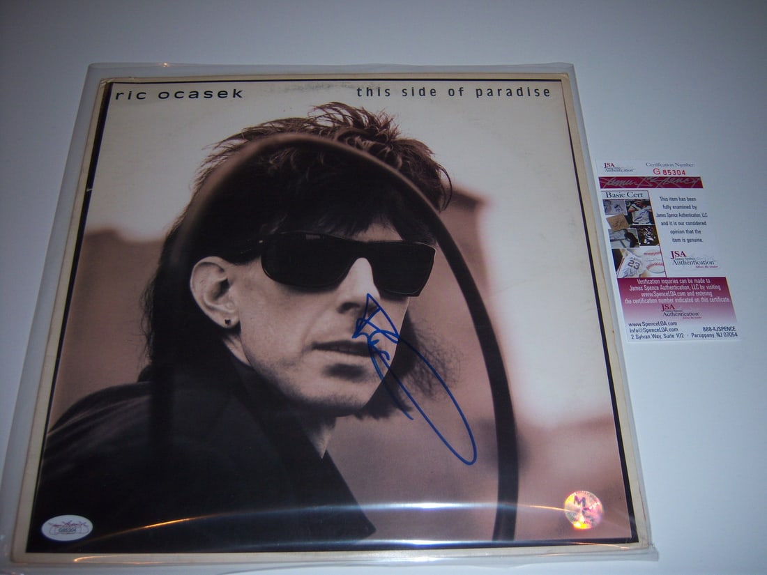 Ric Ocasek Signed This Side of Paradise LP JSA/COA Authentic: Ric Ocasek Signed This Side of Paradise LP JSA/COA Authentic This is an original vinyl LP record album of 'This Side of Paradise' by The Cars, signed by Ric Ocasek. The record is pre-owned and comes w
