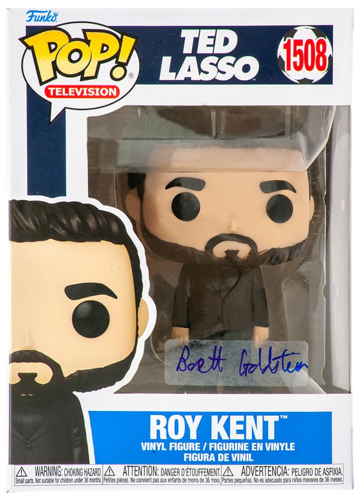 Brett Goldstein Signed Roy Kent Funko Pop Doll #1508 with COA: Brett Goldstein Signed Roy Kent Funko Pop Doll #1508 with COA This is a Brett Goldstein signed Funko Pop doll of Roy Kent from the acclaimed series Ted Lasso, featuring him in a stylish black suit. Th