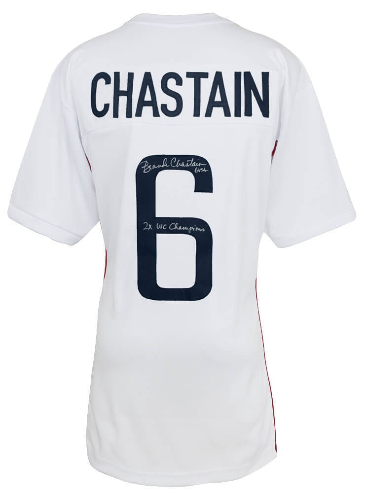 Brandi Chastain Signed Soccer Jersey with 2x WC Champs Inscription: Brandi Chastain Signed Soccer Jersey with 2x WC Champs Inscription This is an original Brandi Chastain signed white custom soccer jersey featuring the inscription '2x WC Champs'. The jersey is a size