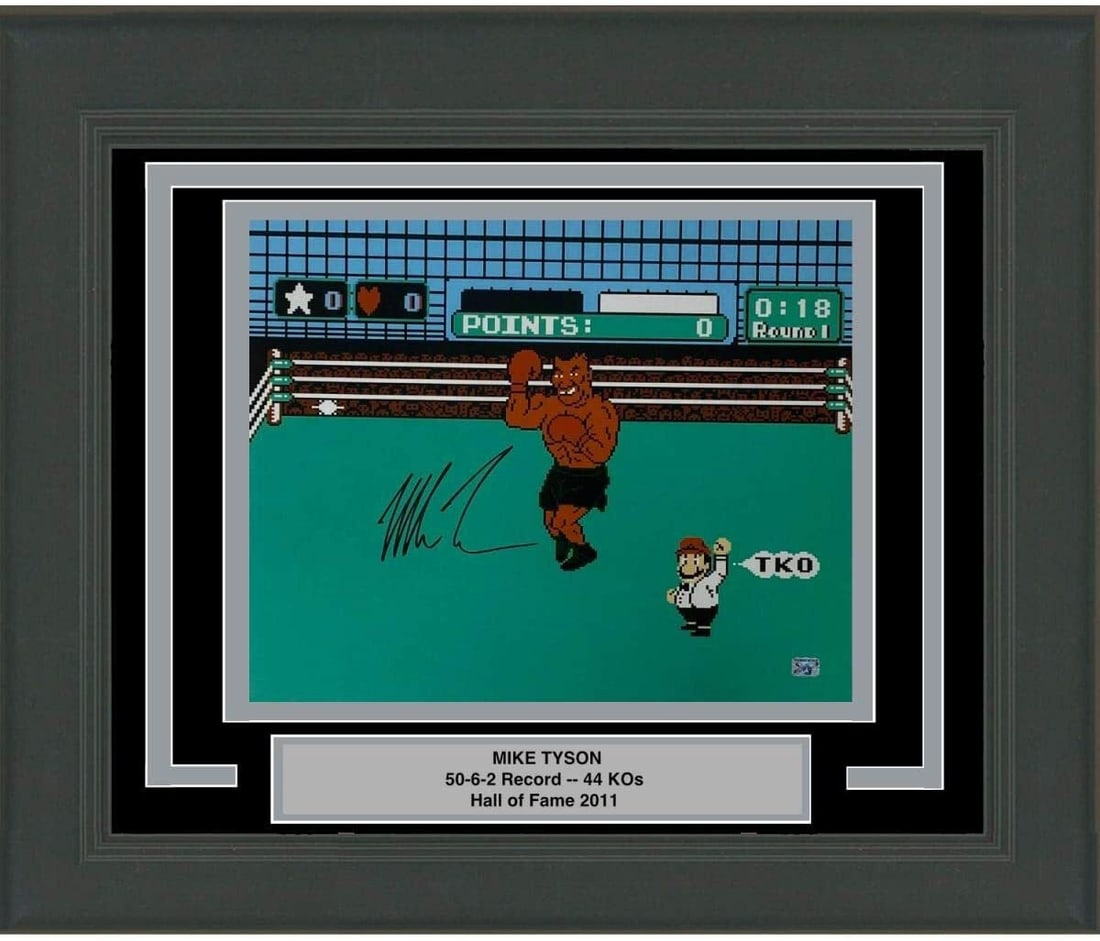 Framed Autographed Mike Tyson Punchout 16x20 Photo JSA Authenticated: Framed Autographed Mike Tyson Punchout 16x20 Photo JSA Authenticated Celebrate the legendary Mike Tyson with this professionally framed and autographed 16x20 photo from the classic Punchout Nintendo g