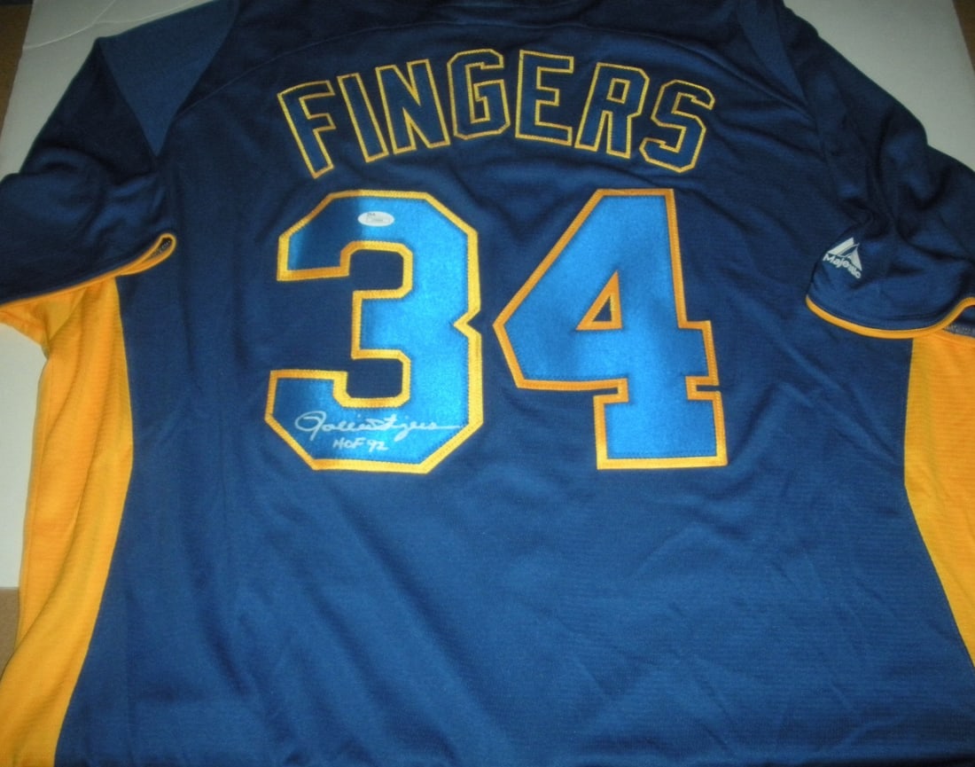 Rollie Fingers Signed Majestic Milwaukee Brewers Jersey with JSA COA: Rollie Fingers Signed Majestic Milwaukee Brewers Jersey with JSA COA This officially licensed Majestic jersey features the signature of Rollie Fingers, a celebrated player of the Milwaukee Brewers. Th
