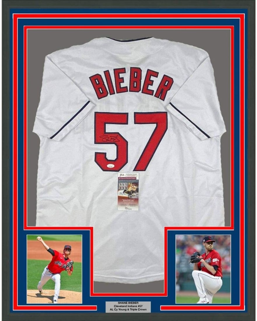 Framed Shane Bieber Signed Jersey 33x42 with JSA Authentication: Framed Shane Bieber Signed Jersey 33x42 with JSA Authentication Elevate your sports memorabilia collection with this stunning framed autographed Shane Bieber jersey. This authentic MLB Cleveland India