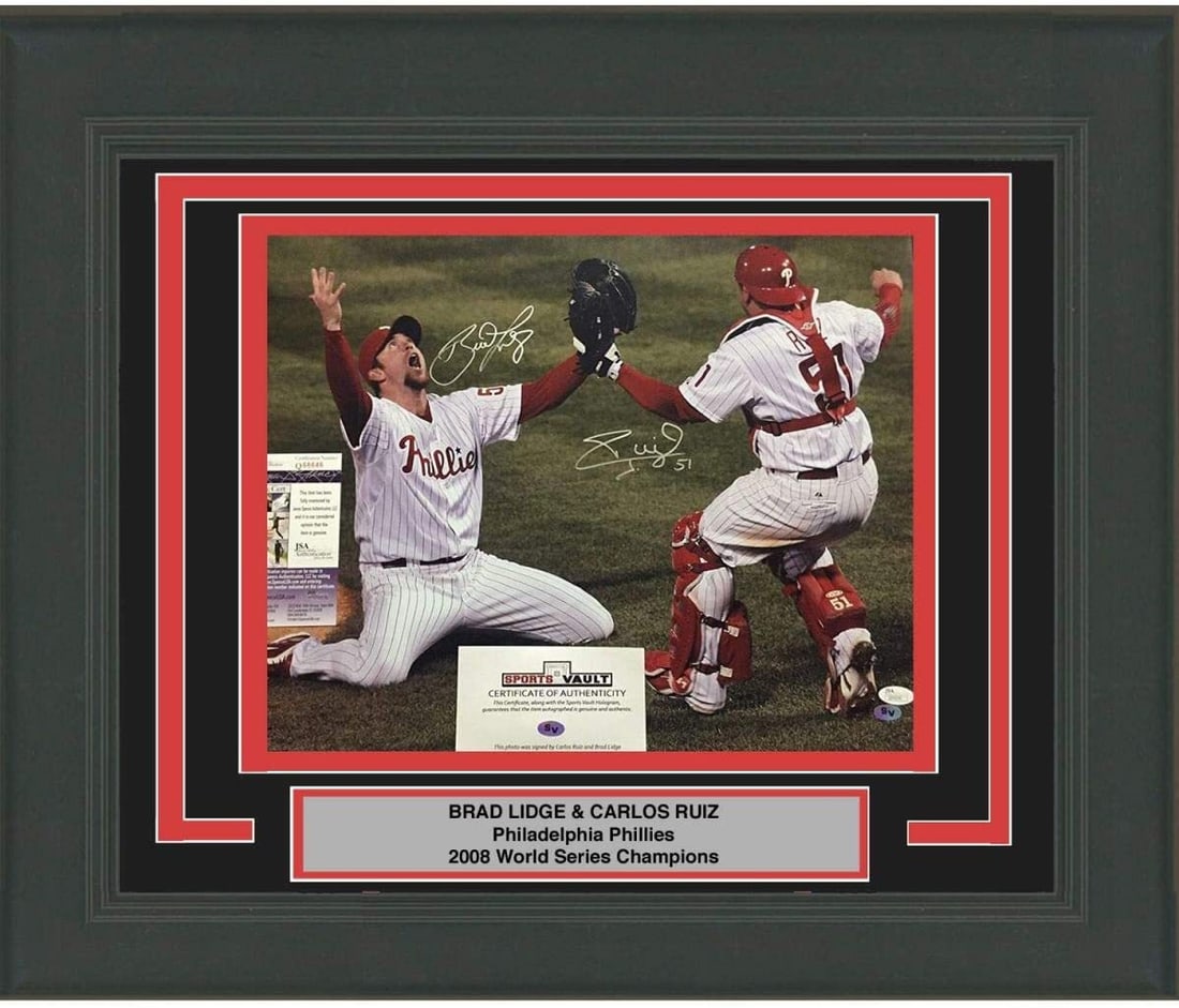 Framed 2008 WS Autographed Photo Brad Lidge Carlos Ruiz JSA COA: Framed 2008 WS Autographed Photo Brad Lidge Carlos Ruiz JSA COA This professionally framed and matted photo features the autographs of Brad Lidge and Carlos Ruiz, key players from the 2008 World Serie