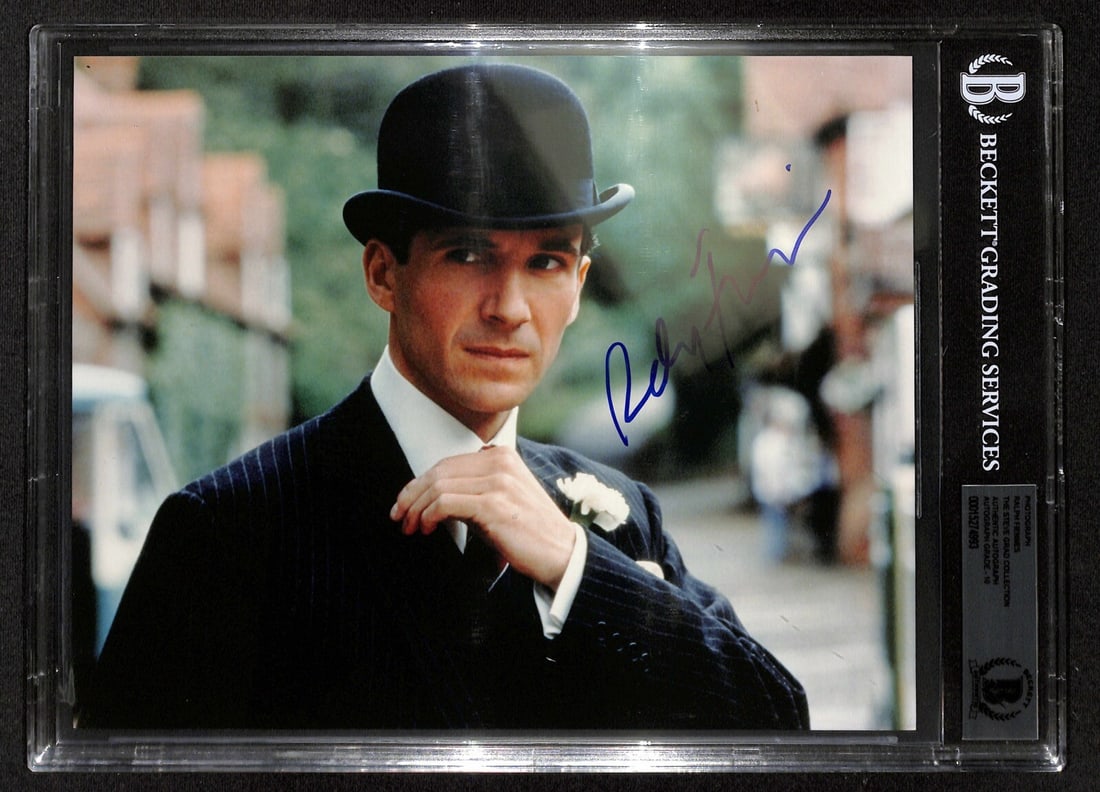 Ralph Fiennes Signed 8x10 Photo as John Steed BAS 10: Ralph Fiennes Signed 8x10 Photo as John Steed BAS 10 This stunning 8x10 color photograph features Ralph Fiennes as John Steed from the movie The Avengers, beautifully autographed in blue permanent mar