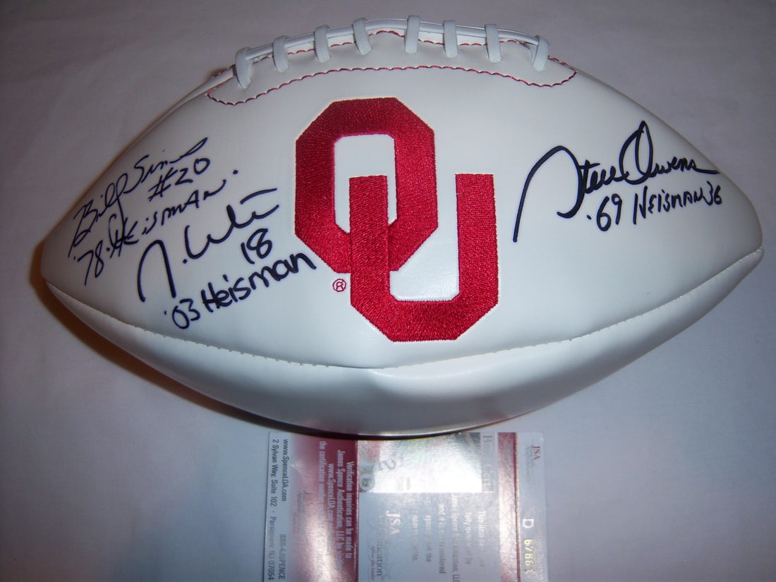 Oklahoma Sooners Signed Football by Owens Sims White JSA COA: Oklahoma Sooners Signed Football by Owens Sims White JSA COA This is an official football signed by Oklahoma Sooners legends Steve Owens, Billy Sims, and Jason White. The football features authentic s