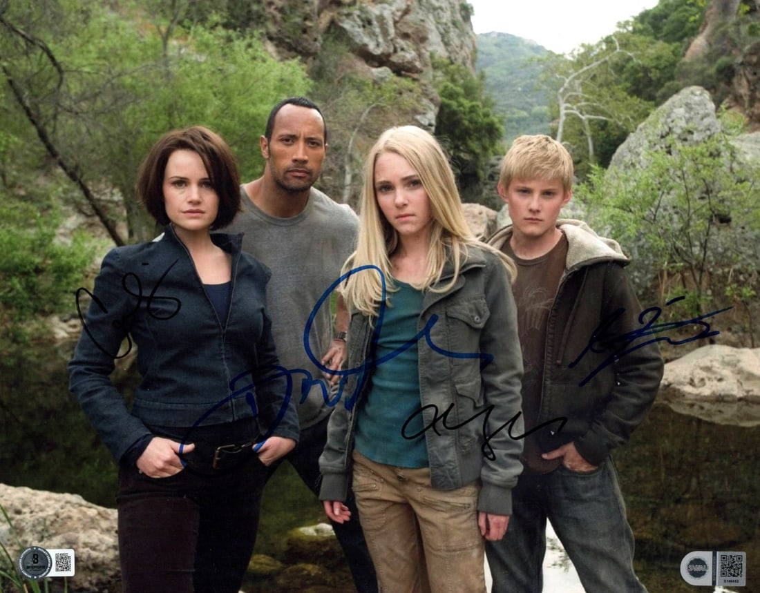 11x14 Photograph Signed by Dwayne Johnson Gugino Robb Ludwig Beckett Authenticated: 11x14 Photograph Signed by Dwayne Johnson Gugino Robb Ludwig Beckett Authenticated This is an original 11x14 inch photograph from Race to Witch Mountain, autographed by Dwayne "The Rock" Johnson, Carl