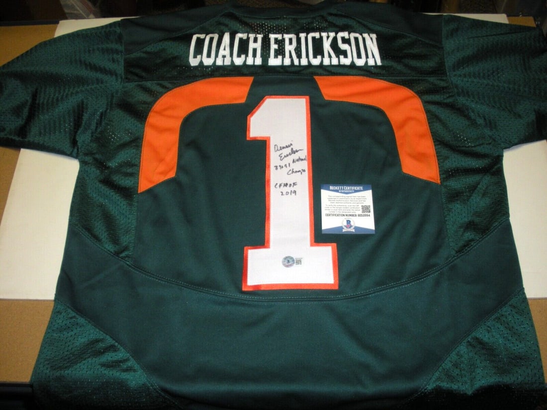 Dennis Erickson Signed Nike Miami Canes Jersey with Beckett COA: Dennis Erickson Signed Nike Miami Canes Jersey with Beckett COA This officially licensed Nike jersey is a signed piece from Dennis Erickson, a notable figure in Miami Hurricanes football history. It i