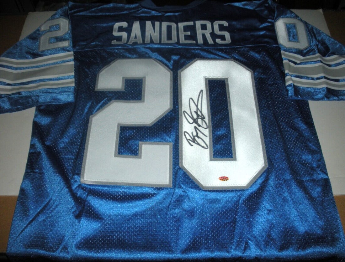 Barry Sanders Signed Official Lions Jersey with COA: Barry Sanders Signed Official Lions Jersey with COA Capture a piece of football history with this officially licensed Russell jersey, signed by the legendary Barry Sanders. This original, pre-owned je