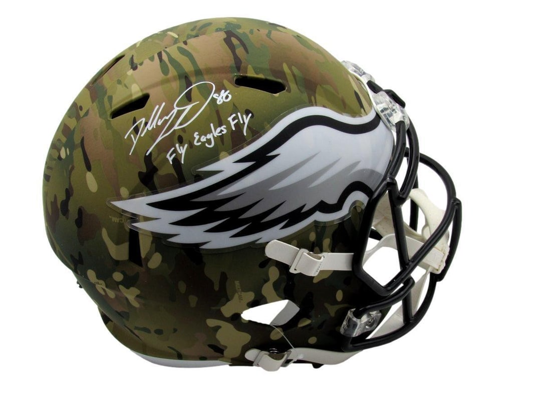 Dallas Goedert Signed Full Size Camo Helmet with Fly Eagles Fly Inscription: Dallas Goedert Signed Full Size Camo Helmet with Fly Eagles Fly Inscription This is a full-size replica football helmet featuring the signature of Dallas Goedert along with the inscription "Fly Eagles