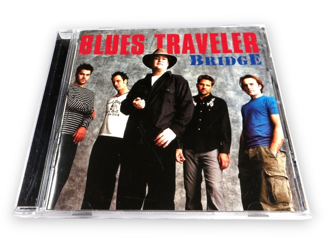 Blues Traveler Autographed CD Signed by John Popper +4 JSA Certified: Blues Traveler Autographed CD Signed by John Popper +4 JSA Certified This is an original Blues Traveler band autographed CD and booklet, featuring signatures from John Popper, Chan Kinchla, Brendan Hi