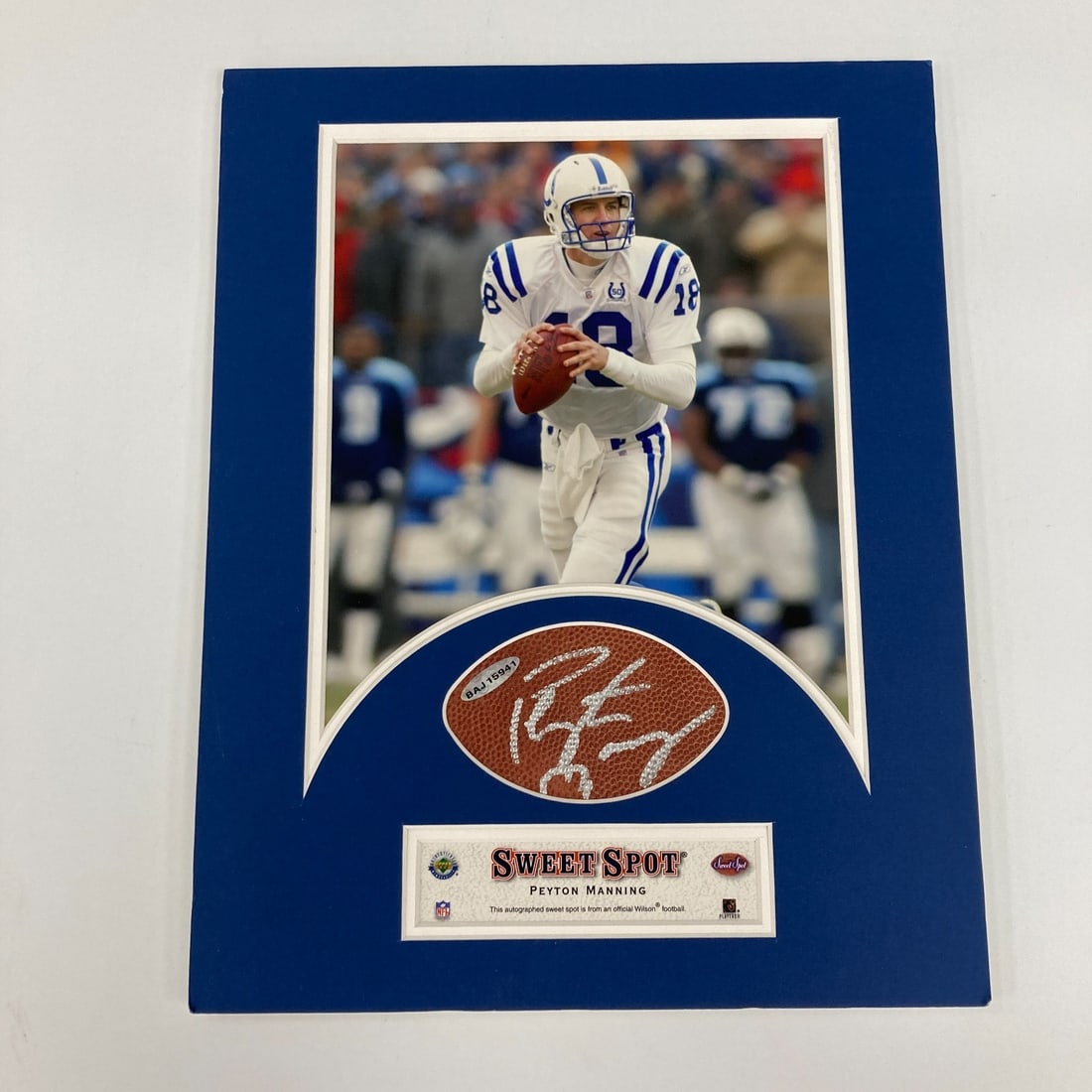 Peyton Manning Signed Football Display UDA Certified 11x14: Peyton Manning Signed Football Display UDA Certified 11x14 This stunning display piece features a genuine autograph from NFL legend Peyton Manning, perfectly showcased in an 11"x14" matted frame. The