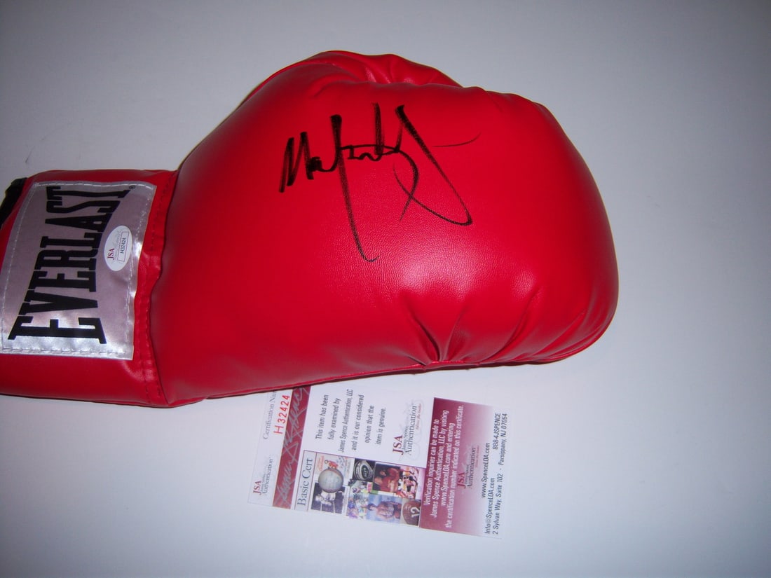 Mark Wahlberg Signed Boxing Glove JSA COA The Fighter Invincible: Mark Wahlberg Signed Boxing Glove JSA COA The Fighter Invincible This is an original boxing glove signed by Mark Wahlberg, known for his roles in the films 'The Fighter' and 'Invincible.' The glove co