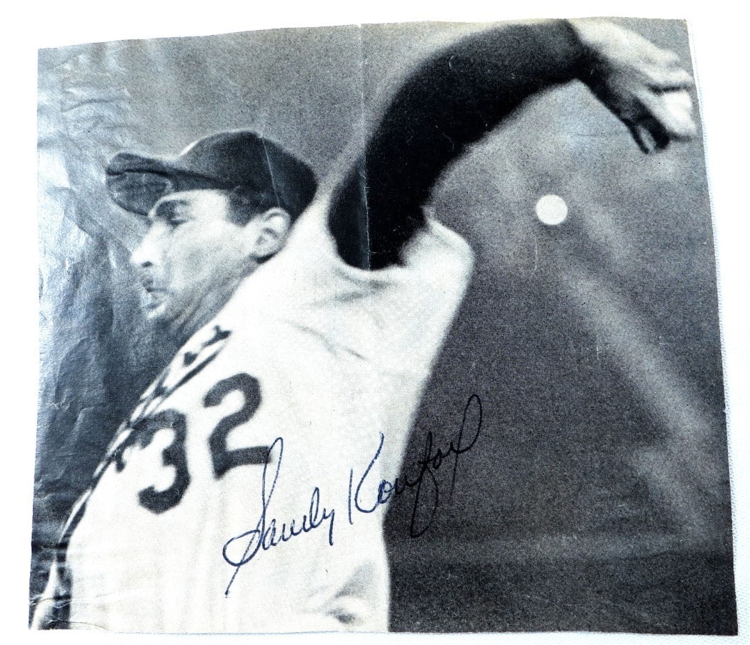 Sandy Koufax Autographed Small Photo Dodgers Vintage JSA Certified: Sandy Koufax Autographed Small Photo Dodgers Vintage JSA Certified Capture a piece of baseball history with this original autographed photo of Sandy Koufax, one of the greatest pitchers of all time. T