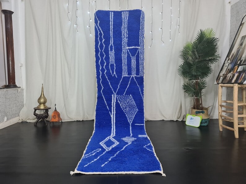 Authentic Blue Runner Rug Handwoven in Morocco 2 x 10 Feet: Authentic Blue Runner Rug Handwoven in Morocco 2 x 10 Feet Enhance your space with this fabulous authentic blue runner rug, handwoven in the Atlas Mountains by skilled local Berber women weavers. Craf