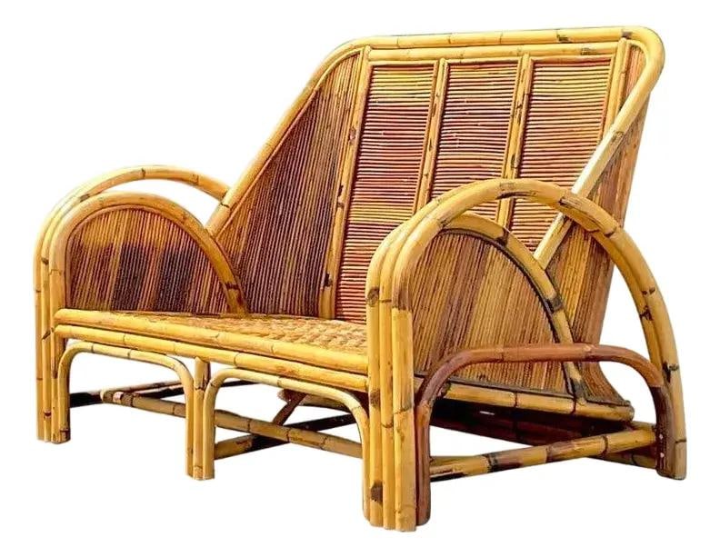 Chic 1950s Vintage Coastal Rattan Pencil Reed Loveseat: Chic 1950s Vintage Coastal Rattan Pencil Reed Loveseat Discover this striking vintage Coastal loveseat, showcasing a chic 1950s design crafted from tortoise shell pencil reed. This elegant piece boast