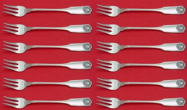 Frank Smith Fiddle Shell Sterling Silver Cocktail Fork Set 12 pcs: Frank Smith Fiddle Shell Sterling Silver Cocktail Fork Set 12 pcs Enhance your dining experience with this exquisite 12-piece Sterling Silver Cocktail Fork Set in the Fiddle Shell pattern by Frank Smi