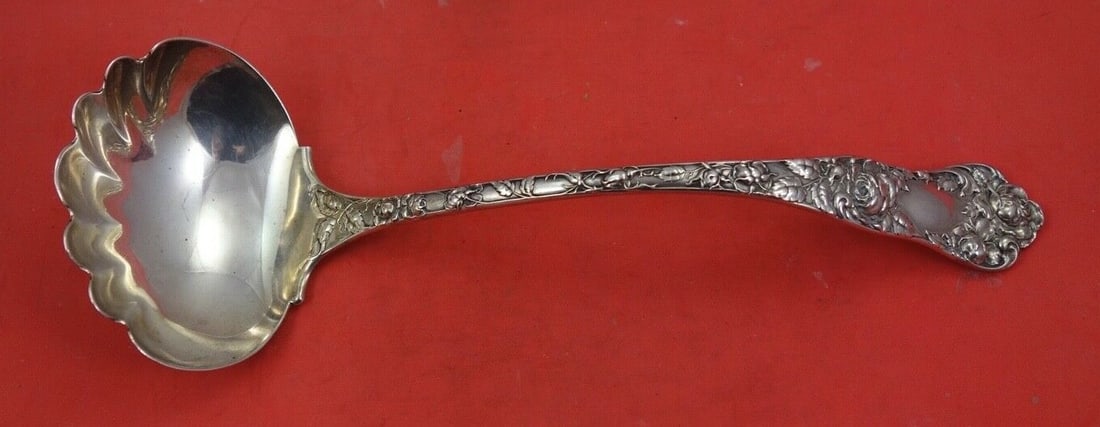 Shiebler American Beauty Sterling Silver Oyster Ladle 11 1/8": Shiebler American Beauty Sterling Silver Oyster Ladle 11 1/8" This exquisite oyster ladle, crafted by Shiebler, showcases the elegant American Beauty pattern and is made of high-quality sterling silve