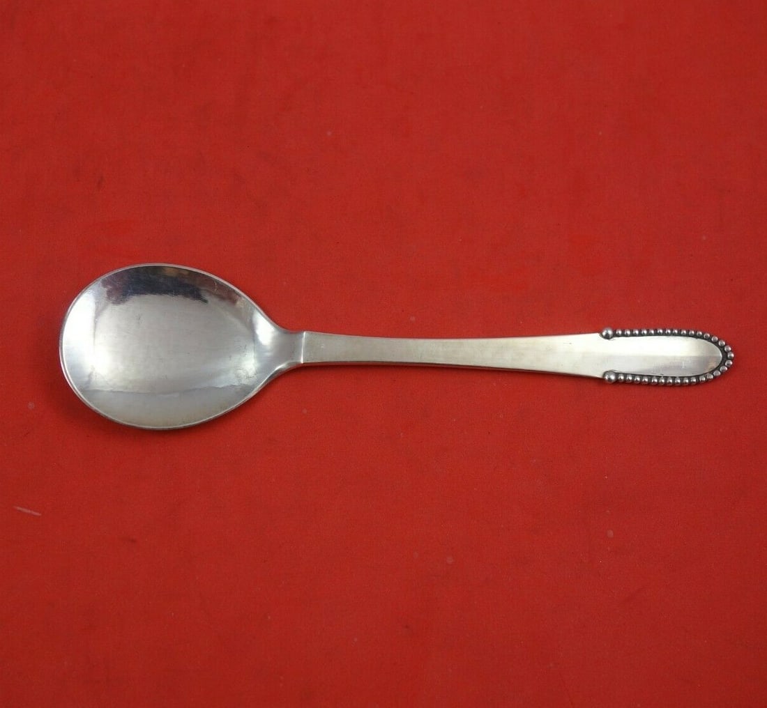 Georg Jensen Beaded Sterling Silver Ice Cream Spoon 5.5": Georg Jensen Beaded Sterling Silver Ice Cream Spoon 5.5" Indulge in elegance with this exquisite ice cream spoon from Georg Jensen, featuring the timeless Beaded pattern. Crafted from high-quality ste
