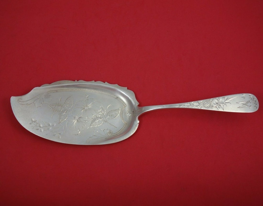 Hennegan and Bates 10.125 Antique Lily Sterling Silver Fish Server: Hennegan and Bates 10.125 Antique Lily Sterling Silver Fish Server This exquisite fish server showcases the Antique Lily Engraved pattern by Hennegan and Bates. Crafted from high-quality sterling silv