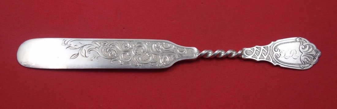 Vanderslice Twist Sterling Silver Tea Knife Flat Handle 7 1/4": Vanderslice Twist Sterling Silver Tea Knife Flat Handle 7 1/4" This elegant tea knife is part of the Twist pattern by Vanderslice, crafted from high-quality sterling silver. The knife features a flat