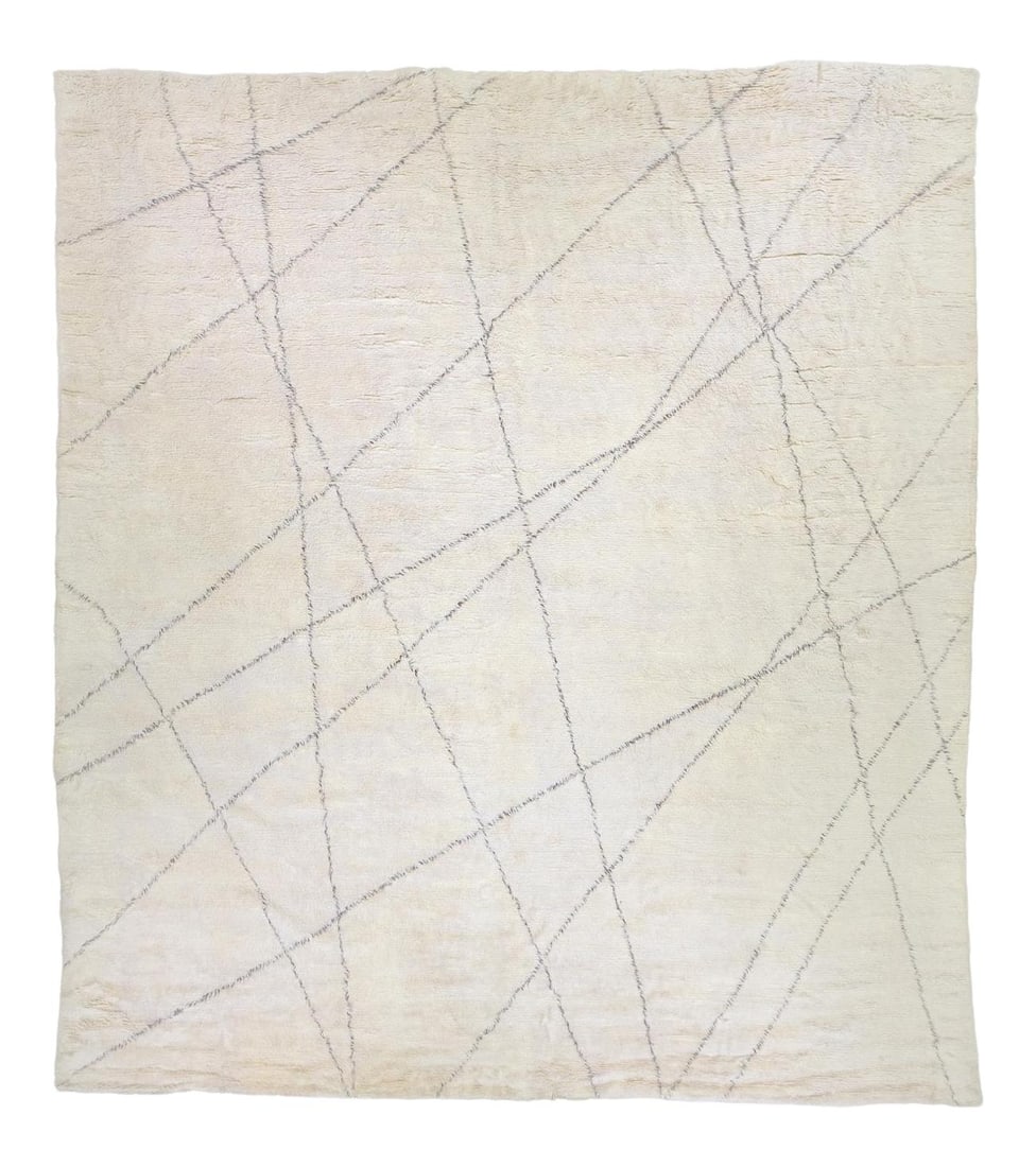 Oversize Handmade Ivory Wool Moroccan Tribal Rug: Oversize Handmade Ivory Wool Moroccan Tribal Rug Enhance your space with this stunning modern oversize Moroccan-style handmade wool rug. Featuring a soft ivory field adorned with rich brown accents, t