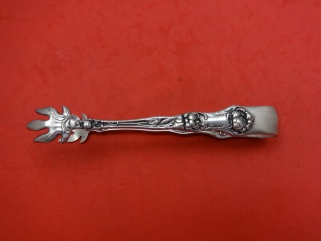 Wallace Peony Sterling Silver Sugar Tongs 4 3/4 Inch Serving Piece: Wallace Peony Sterling Silver Sugar Tongs 4 3/4 Inch Serving Piece Introducing the Peony sugar tongs by Wallace, crafted from high-quality sterling silver. This exquisite serving piece features the el