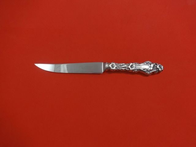 Whiting Lily Sterling Silver Custom Steak Knife 8.5 Inch Serrated: Whiting Lily Sterling Silver Custom Steak Knife 8.5 Inch Serrated Crafted from fine sterling silver, this Lily by Whiting steak knife features a hollow handle and a stainless steel serrated blade, per