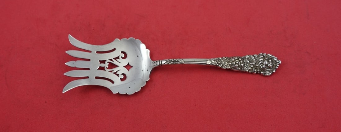 Reed and Barton Trajan Sterling Silver Pierced Beef Fork 6.25": Reed and Barton Trajan Sterling Silver Pierced Beef Fork 6.25" This exquisite Trajan serving fork by Reed and Barton is crafted from high-quality sterling silver. The fork features a pierced design an