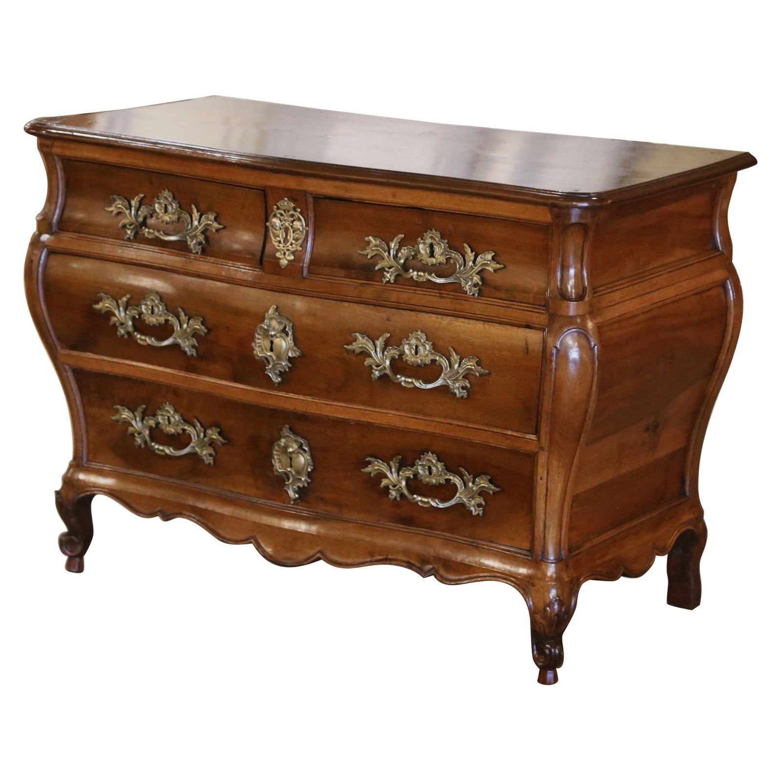 Louis XV Antique Walnut Chest of Drawers from Bordeaux: Louis XV Antique Walnut Chest of Drawers from Bordeaux This exquisite 18th Century French Louis XV carved walnut chest of drawers, known as a "Commode Tombeau," showcases the elegance of mid-18th cent