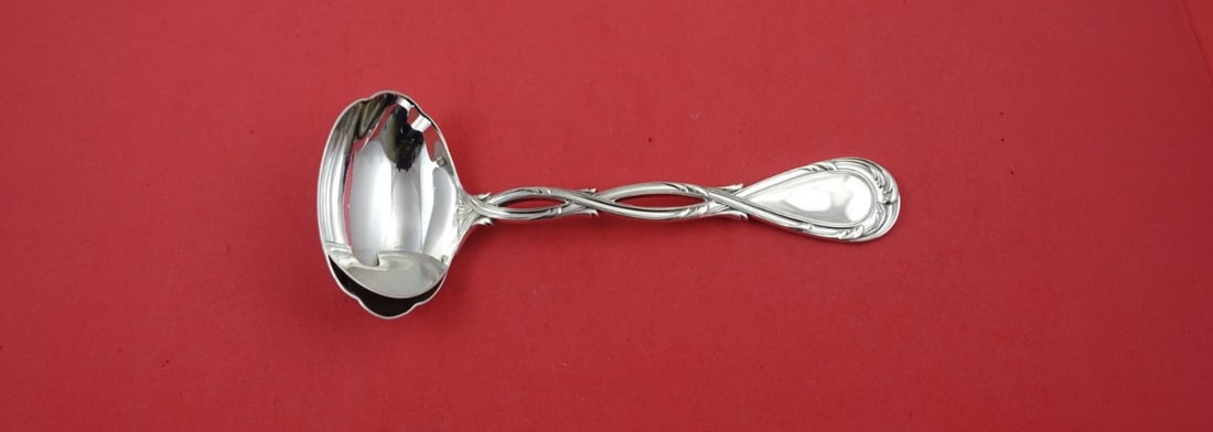 Puiforcat Royal Sterling Silver Gravy Ladle with Separator 7 1/8": Puiforcat Royal Sterling Silver Gravy Ladle with Separator 7 1/8" This exquisite gravy ladle from the Royal pattern by Puiforcat is crafted from high-quality sterling silver and features a fat and lea