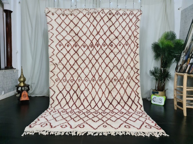 Authentic Handmade Moroccan Berber Wool Rug 8 x 5 Feet: Authentic Handmade Moroccan Berber Wool Rug 8 x 5 Feet Experience the charm of authentic craftsmanship with this Handmade Moroccan Berber Wool Rug. Skillfully handwoven by local Berber women weavers i